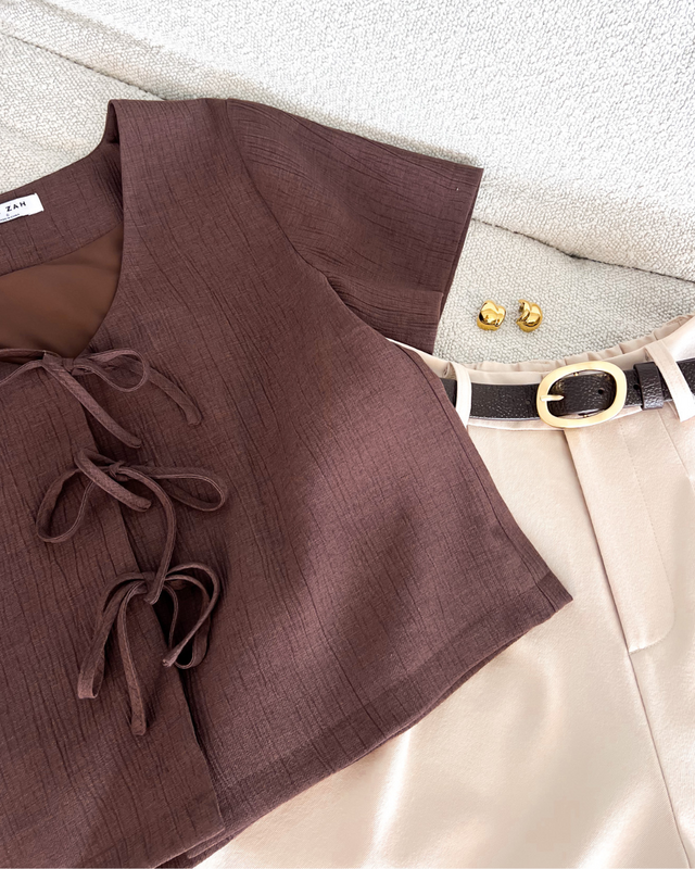 Elevate your wardrobe with the Onyx Tie Tee